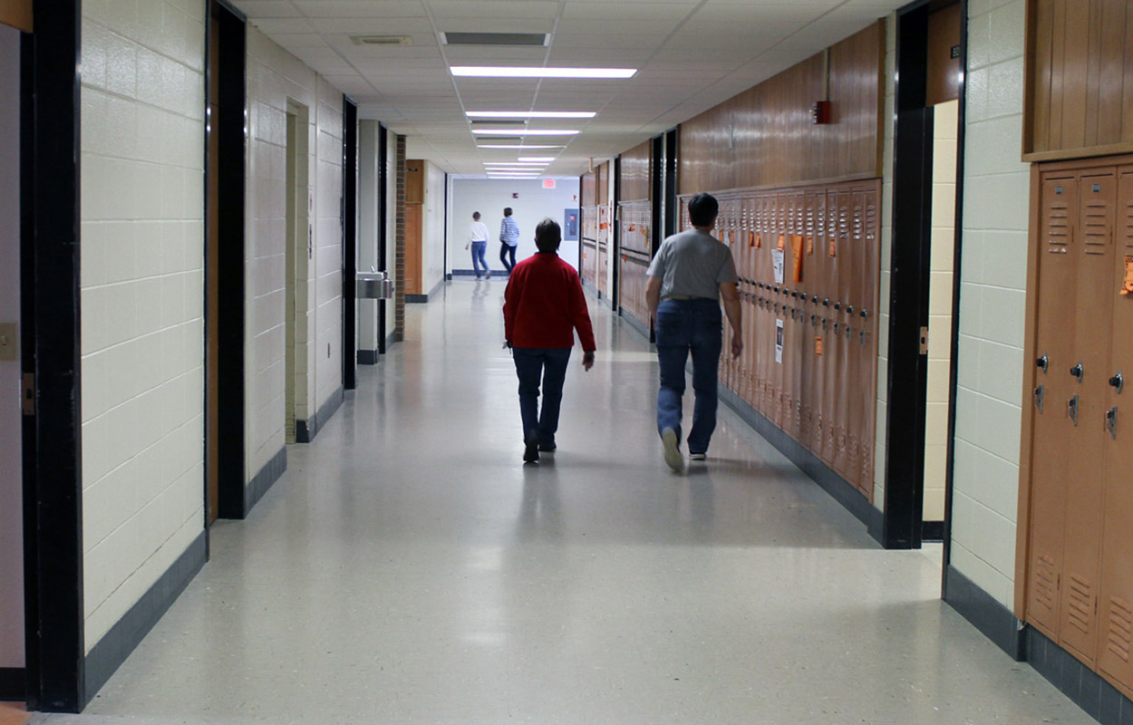 people walking PHS hallway